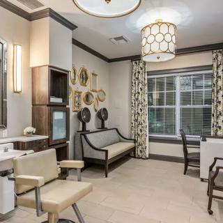 A stylish and modern salon interior with comfortable seating and elegant decor.