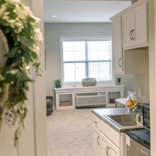A bright and inviting kitchen interior with a view of a window.