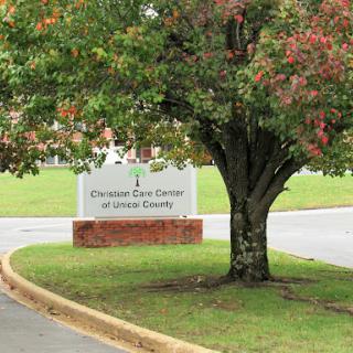 Sign for the healthcare facility located in Lincoln County, surrounded by greenery.