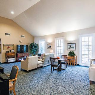 A spacious living room with comfortable seating and a television.