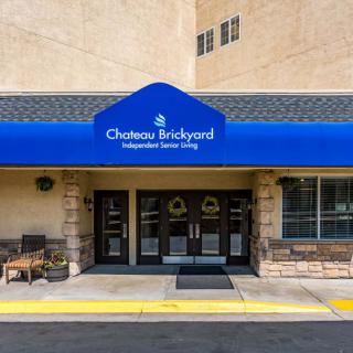 Entrance to Chateau Brickyard with blue awning and signage.