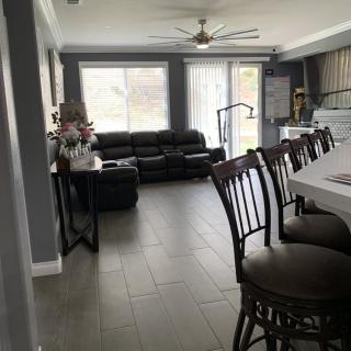 Spacious open-concept living and kitchen area with modern furnishings.