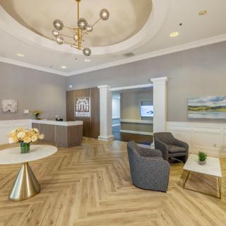 A modern office reception area with elegant furnishings and decor.