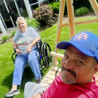 Enjoying a sunny day together in the garden, sharing smiles and memories.