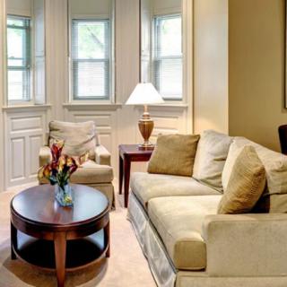 A cozy living room with comfortable seating and soft lighting.