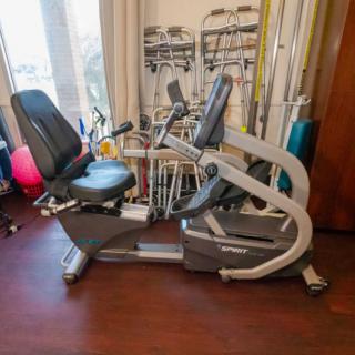 A recumbent exercise bike in a fitness room.