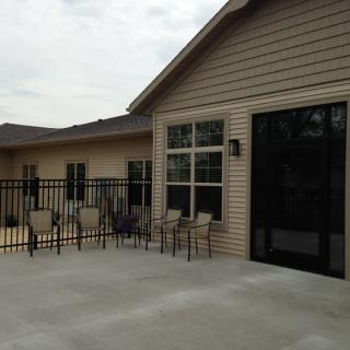 Spacious patio area with outdoor seating and a fenced deck.
