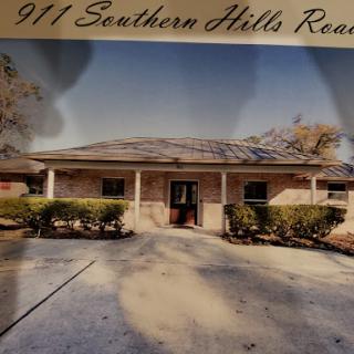 A charming residential building located at 911 Southern Hills Road.