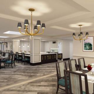 A modern dining room featuring elegant chandeliers and stylish seating arrangements.