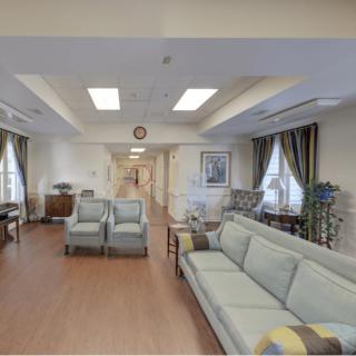 A spacious lobby with comfortable seating and elegant decor.