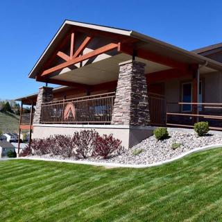 Modern house with well-maintained landscaping and stone accents.