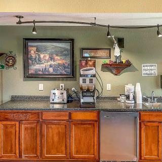 A cozy kitchen area with a coffee machine, toaster, and neatly organized countertop.