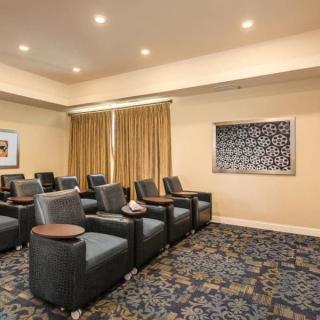 A cozy theater room with comfortable seating and elegant interior decor.