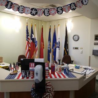 A festive office space decorated with various flags and patriotic themes for Independence Day celebrations.