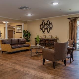 A cozy living room with comfortable seating, warm tones, and inviting decor.