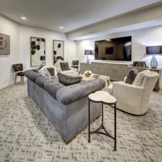 A modern living room with sleek furniture and stylish decor.