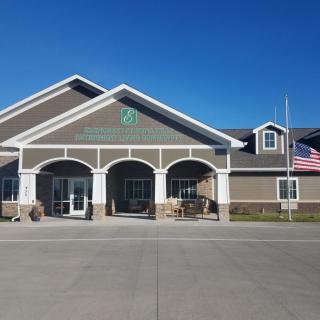 A community center with an American flag displayed outside.