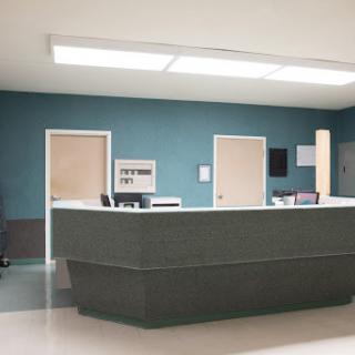 A modern hospital reception area with a sleek design and calming color scheme.