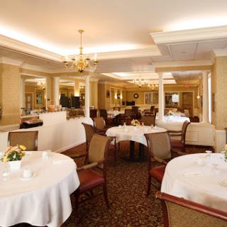 An elegant dining area featuring beautifully set tables and tasteful decor.