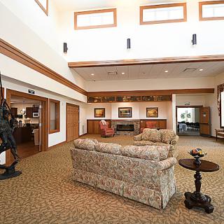 A spacious lobby area with comfortable seating and decorative artwork.