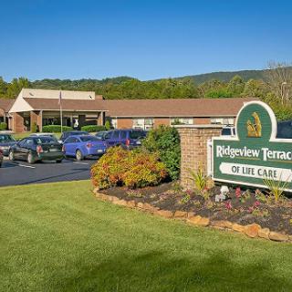 Entrance to Ridgeview Terrace showcasing its welcoming sign and well-maintained landscape.