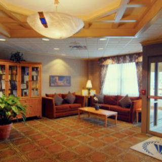 A cozy lobby with comfortable seating and warm lighting.