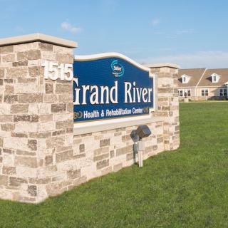 Grand River Health & Rehabilitation Center sign outside a building.
