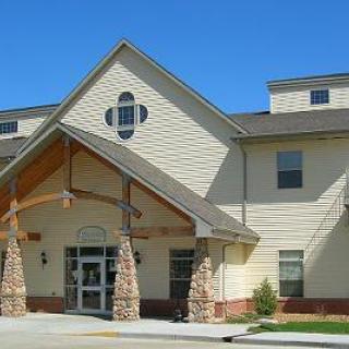 A charming residential building featuring a welcoming entrance and distinctive architectural details.