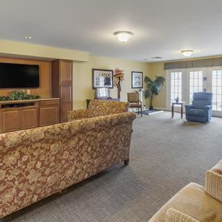 A cozy living room with comfortable seating and a television.
