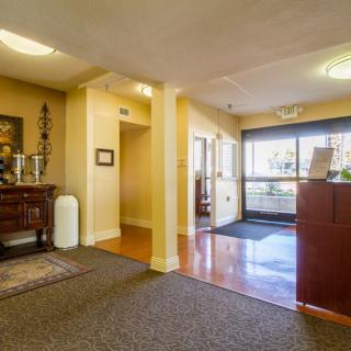 A welcoming office reception area with warm lighting and comfortable decor.