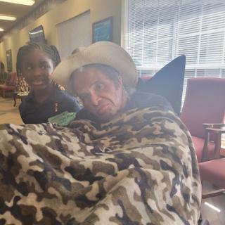A cheerful moment in a waiting area, showcasing companionship and comfort.