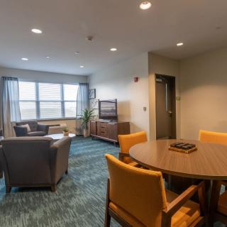 A cozy living room with comfortable seating and a TV setup.