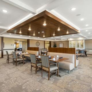 A modern dining area featuring stylish booth seating and elegant lighting.