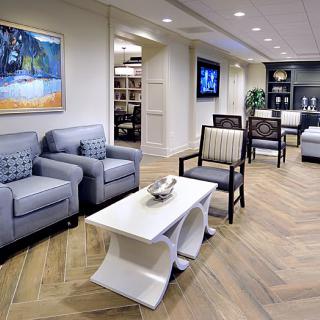 A modern and stylish lobby area with comfortable seating and decorative artwork.