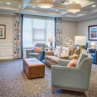 A cozy living room with comfortable seating and elegant decor.