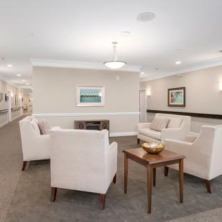 A modern and well-lit lobby with comfortable seating arrangements and tasteful decor.