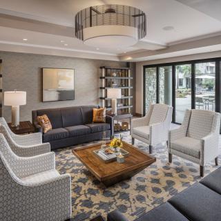 A modern living room with stylish furniture and a cozy seating arrangement.