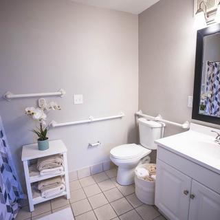 A clean and neatly organized bathroom with a modern design.