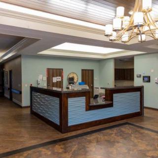 A modern reception area with stylish lighting and wooden accents.