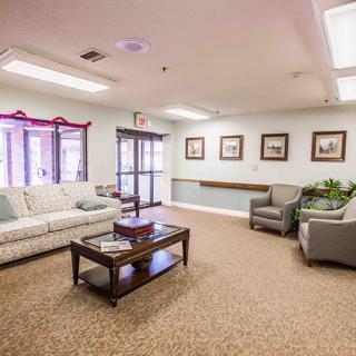 A cozy living room with sofas, chairs, and a coffee table.