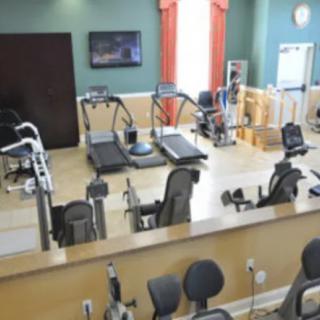 A well-equipped gym featuring treadmills and exercise machines.
