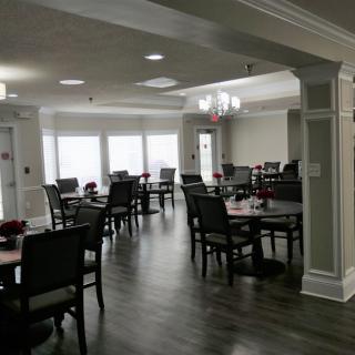 A cozy dining area with elegant furnishings and natural lighting.
