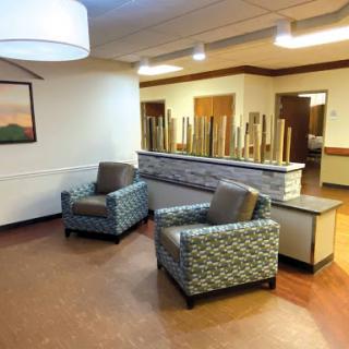 A cozy waiting area featuring comfortable chairs and a modern design.