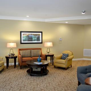 A cozy living room with comfortable seating and warm lighting.