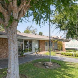 A suburban house with a well-maintained lawn and garden.