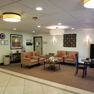A cozy and inviting lobby area with comfortable seating and decorative elements.