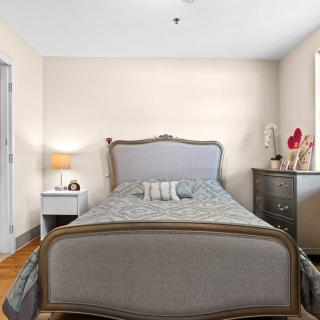 A cozy bedroom with a vintage-style bed and elegant furnishings.