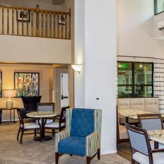 A spacious and modern lobby area featuring comfortable seating and stylish decor.
