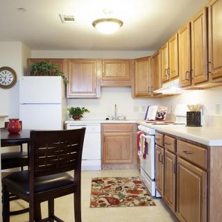 Cozy kitchen with wooden cabinets and modern appliances.