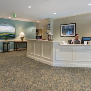 A welcoming reception area with a front desk and seating arrangements.